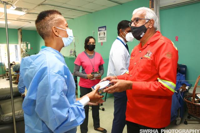 The Minister of Health, The Honorable Terrence Deyalsingh with of Oncology Staff