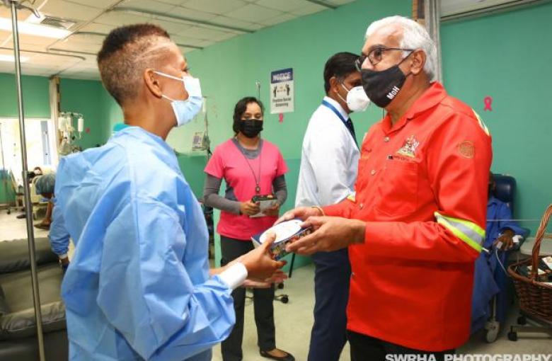 The Minister of Health, The Honorable Terrence Deyalsingh with of Oncology Staff